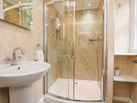 A bathroom with a shower and sink at Sunnyvale House in Whitby
