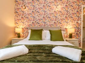 A bedroom with a bed and bedside tables at Sunnyvale House in Whitby