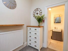 A hallway with a drawer unit and sink at Sunnyvale House in Whitby