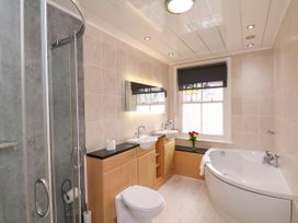A bathroom with shower and bathtub at Sunnyvale House in Whitby