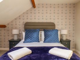 A bedroom with a bed and bedside tables at Sunnyvale House in Whitby
