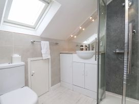 A bathroom with toilet, sink, and shower at Sunnyvale House in Whitby