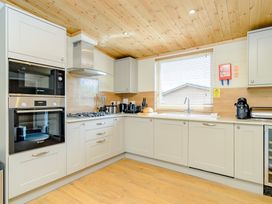 A kitchen with appliances and countertops at The Fotheringhay in Kings Cliffe