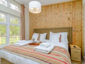 A bedroom with a bed and a tea tray at The Fotheringhay in Kings Cliffe
