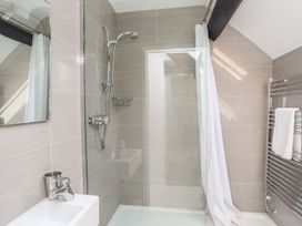 A bathroom with a shower and sink at Bryn Tegid in Beaumaris