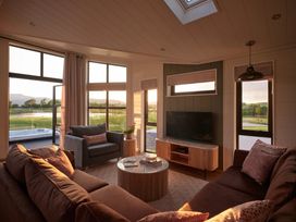 A living room with a sofa and a coffee table at Wansfell in Penrith
