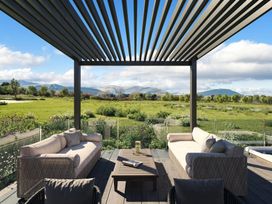 An outdoor patio with seating and a view at Fell Side in Penrith