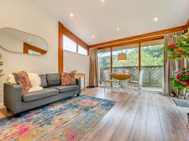 A living room with a sofa and a table at Piran Spa Lodge Pet in Perranporth
