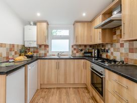 A kitchen with appliances and countertops at Droskyn Spa Pet Perranporth