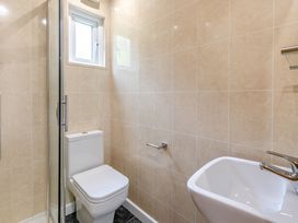 A bathroom with a shower and toilet at Morva Spa Pet Perranporth