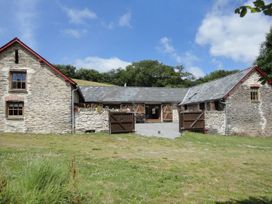 A house exterior with a stone facade at Nethercote Byre in Minehead