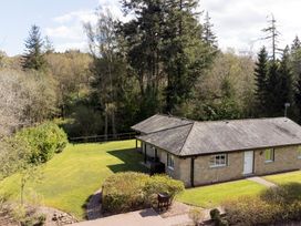 A house with a garden and trees at The Allensford (Pet) Slaley