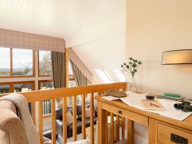 A loft area with a desk and binoculars at The Derwent (Pet) Slaley