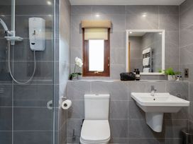 A bathroom with a sink and shower at The Derwent (Pet) in Slaley
