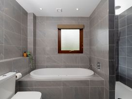 A bathroom with a bathtub and shower in The Hexham Slaley