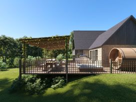 An outdoor area with a deck and seating at Heatherwood (Pet) Slaley