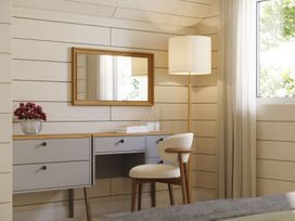 An office with a desk, lamp, and mirror at Heatherwood (Pet) in Slaley