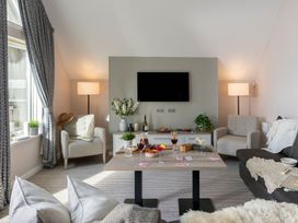 A living room with a sofa and armchairs at The Hexham Spa in Slaley