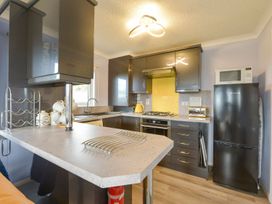 A kitchen with modern appliances at Dartmoor View in Exeter