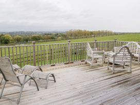 An outdoor area with chairs and a view at Dartmoor View in Exeter