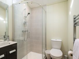 A bathroom with a shower, sink, toilet, and towel rail at Stokesley (Pet) Great Ayton
