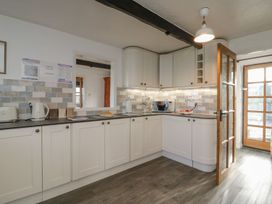 A kitchen with a microwave and kettle at Long Linney in Bideford