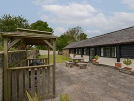 A garden area with a gazebo and seating at Long Linney in Bideford