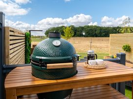 A Big Green Egg grill on an outdoor table at The Oasis in Great Ayton