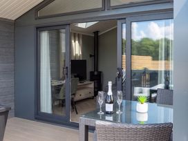 An outdoor patio with a table and chairs at The Oasis in Great Ayton