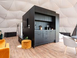 A kitchen unit with appliances in a living space at The Dome in Great Ayton