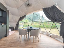 A dining area with a table and chairs at The Dome in Great Ayton