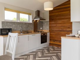 A kitchen with appliances and wood accents at Greystone in Great Ayton