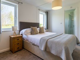 A bedroom with a bed and nightstand at Greystone in Great Ayton