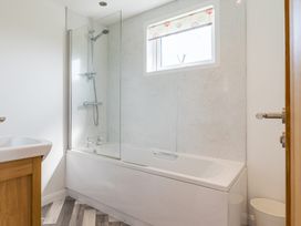 A bathroom with a bathtub and shower at Greystone in Great Ayton