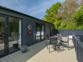 An outdoor seating area with a table and chairs at The Langham in Great Ayton
