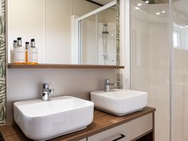 A bathroom with two sinks and a shower at The Woods in Great Ayton