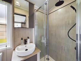 A bathroom with a shower and sink at The Woods in Great Ayton