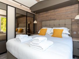 A bedroom with a bed and pillows at The Woods in Great Ayton