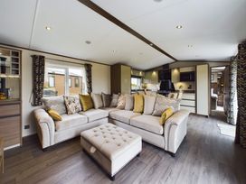 A living room with a sofa and coffee table at The Woods (Pet) in Great Ayton