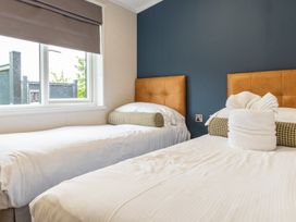 A bedroom with two beds and a window at Rosedale in Great Ayton