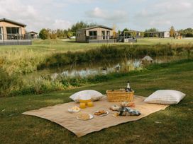 A picnic setup near a water body at Leven (Pet) Great Ayton