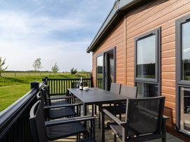 An outdoor patio with a table and chairs at Roseberry in Great Ayton