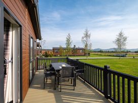A deck with a table and chairs at Roseberry Great Ayton