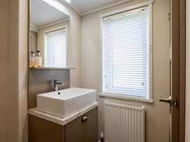 A bathroom with a sink and mirror at Roseberry in Great Ayton
