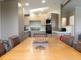 A kitchen with a table and chairs at Roseberry in Great Ayton
