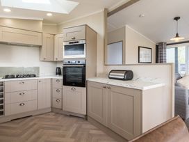 A kitchen with appliances and cabinets at Roseberry (Pet) Great Ayton