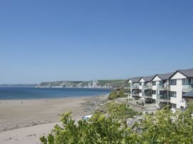 A view of a beach and apartment building at 2 Burgh Island Causeway Kingsbridge