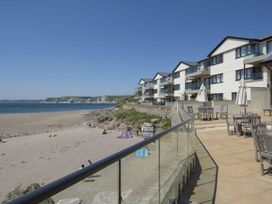 An outdoor area with tables and beach view at 2 Burgh Island Causeway in Kingsbridge