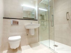 A bathroom with a sink, toilet, and shower at 2 Burgh Island Causeway in Kingsbridge