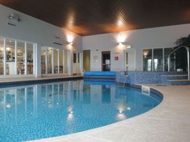 An indoor pool with a bar area at 2 Burgh Island Causeway in Kingsbridge